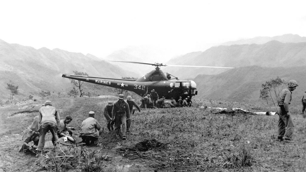 helicopter and medics in war scene