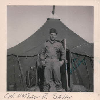 Cpl. Nathan R Sally in front of tent