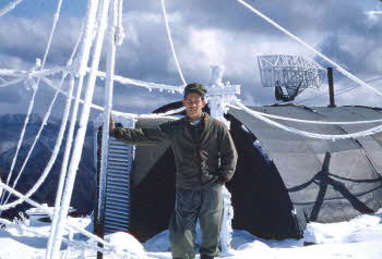 Bert Crowson in front of tent on snowfields