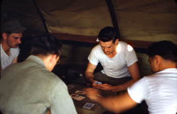 Playing card game inside tent