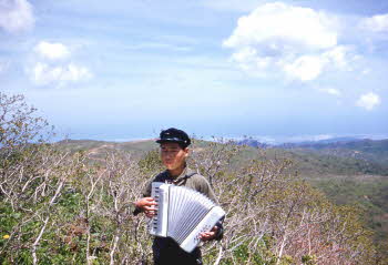 Korean house boy playing melodeon