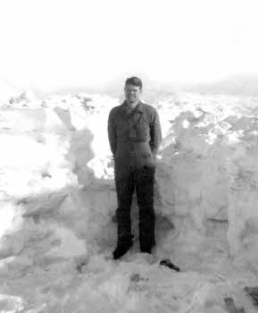Richard Hambley standing in shoulder high snow (close up)