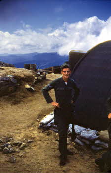 A soldier in front of tent