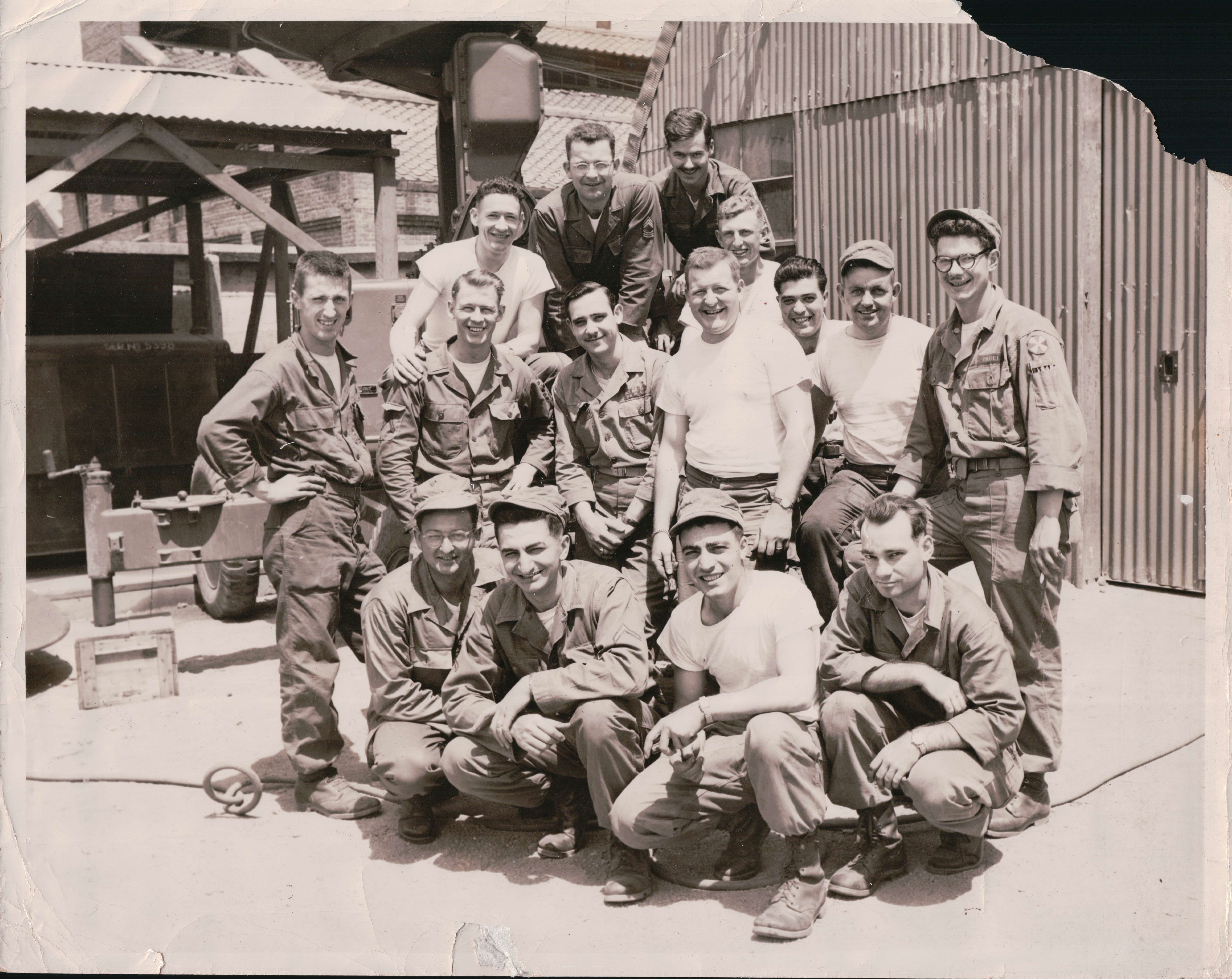 Saltzman with a Group of Technicians and Repairmen