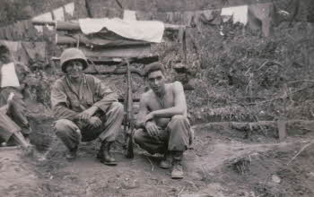 Soldiers Sitting down with His Back to Clothes Lines