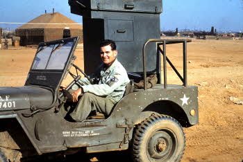 Edward Foely driving a military car