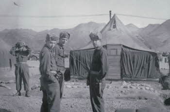 Gathered soldiers infront of tent