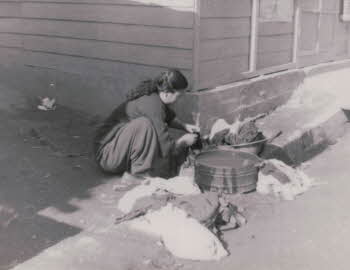 A Korean woman doing laundry with a washtub