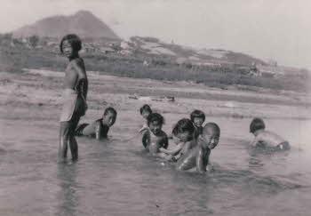 Korean children having bath at river