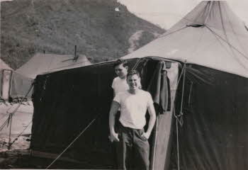 Dave Allen standing in front of his tent