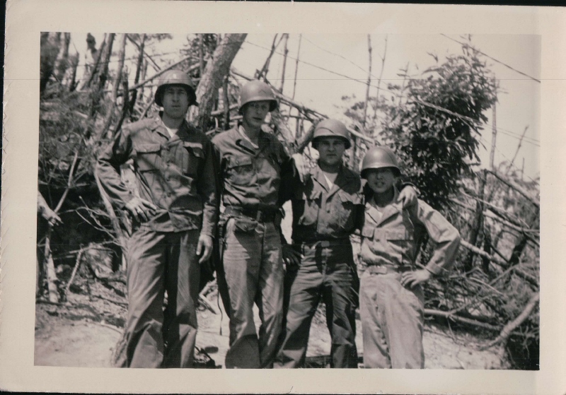 Larry Kinard (Left) standing with fellow soldiers.