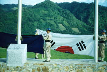Flag raising on military ceremony - flags of UN and ROK