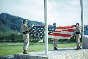 Flag raising on military ceremony - flags of U.S.A.