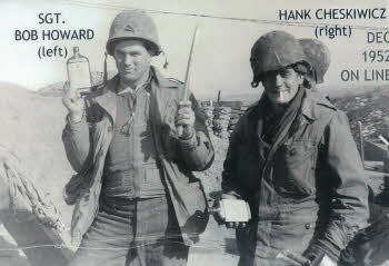 SGT. Bob Howard and Hank Cheskiwicz holding bottles