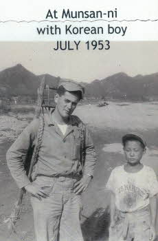 Norman Champagne carrying Korean A-frame next to Korean boy