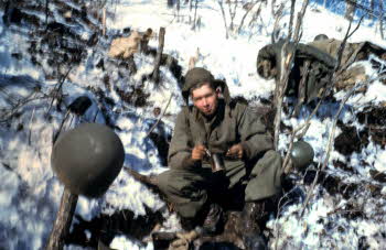 PFC (Private First Class) Peter Doyle eating canned food, beans 