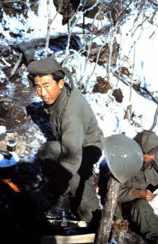 Jo Joong Koo melting snow in helmet for water, for coffee,  chocolate, or washing