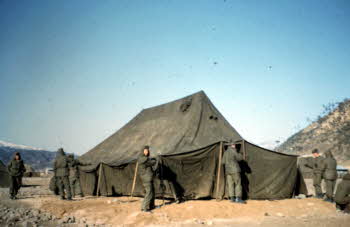 Squad tent up. (sleeps 20 men, two kerosene stoves)