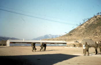View Near 17th REGT. Command Post tent and new metal buildings