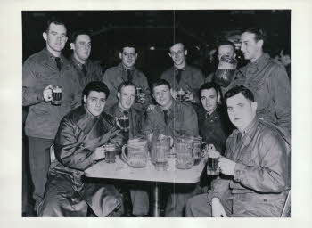 CAMP STONEMAN NEAR SAN FRANCISCO, SOME OF THE 278 R.C.T FROM FT. DEVENS, MARSS. BASIC TRAINING. THE BEER HALL (L~R: 1st line - Joe Leo, Luck, Bert Bozzuto, Bender, Tomy Draga, Sehuctz Scvchtz, Bob Brewster, Thad?, Mabin, Dwicett / 2nd line - Mains, Bob Zehander, Mcarty, George Russell, Al Carrario, Wayne Mansfield ), When boarding ship the band played 