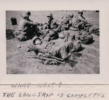 Soldiers lying down and taking rest during the long trip