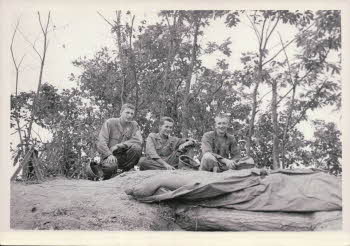 SGT. Carl Cook, SGT. Fred Staton, SGT. John R. Berns of top of 30 cal. Herby MG bunker