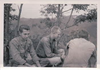 SGT. Fred Staton, SGT. John R. Berns and SGT. Carl Cook (watching poundinging 