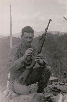 Corporal Patrick Anderson with Carbine, but was marching gunner, same squad as Peter Doyle in Dog Co., 17th REGT. 7th Division. Hometown is Weirton, West Virginia.