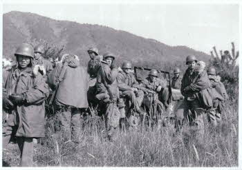Dog Co. men just arrived at Punchbowl front from Yang-gu. At left, Jo Joong Koo, ROK soldier