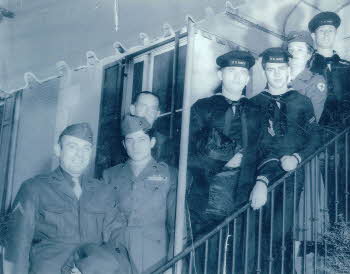 A photo of Peter Fischetti and others in uniforms (front)
