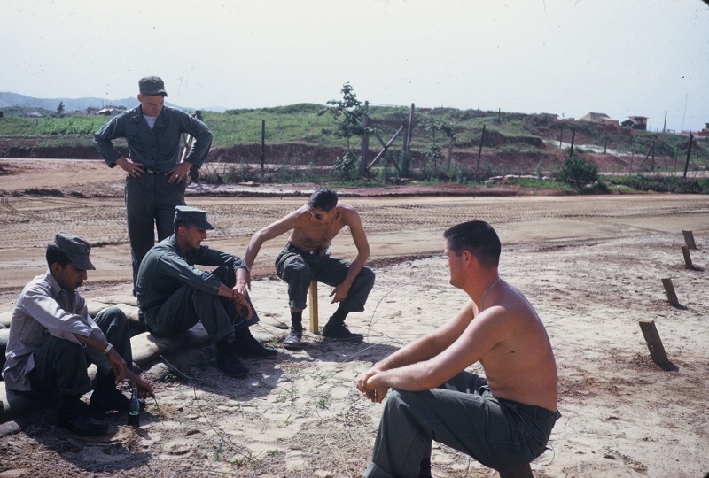 A picture of soldiers during a bomb dump bull session.