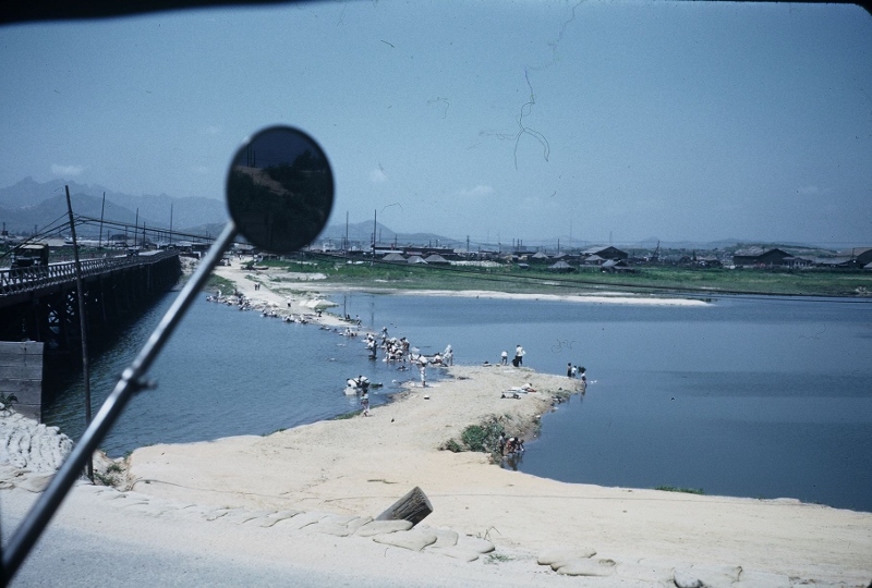 Soldiers doing their laundry in the Han River. Taken in Korea, 1953.