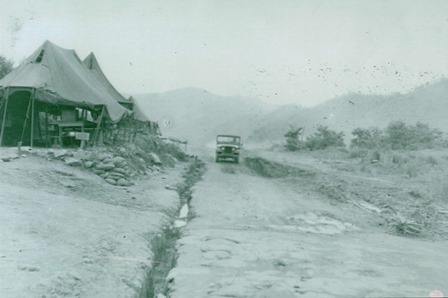 Truck on the road by tent line