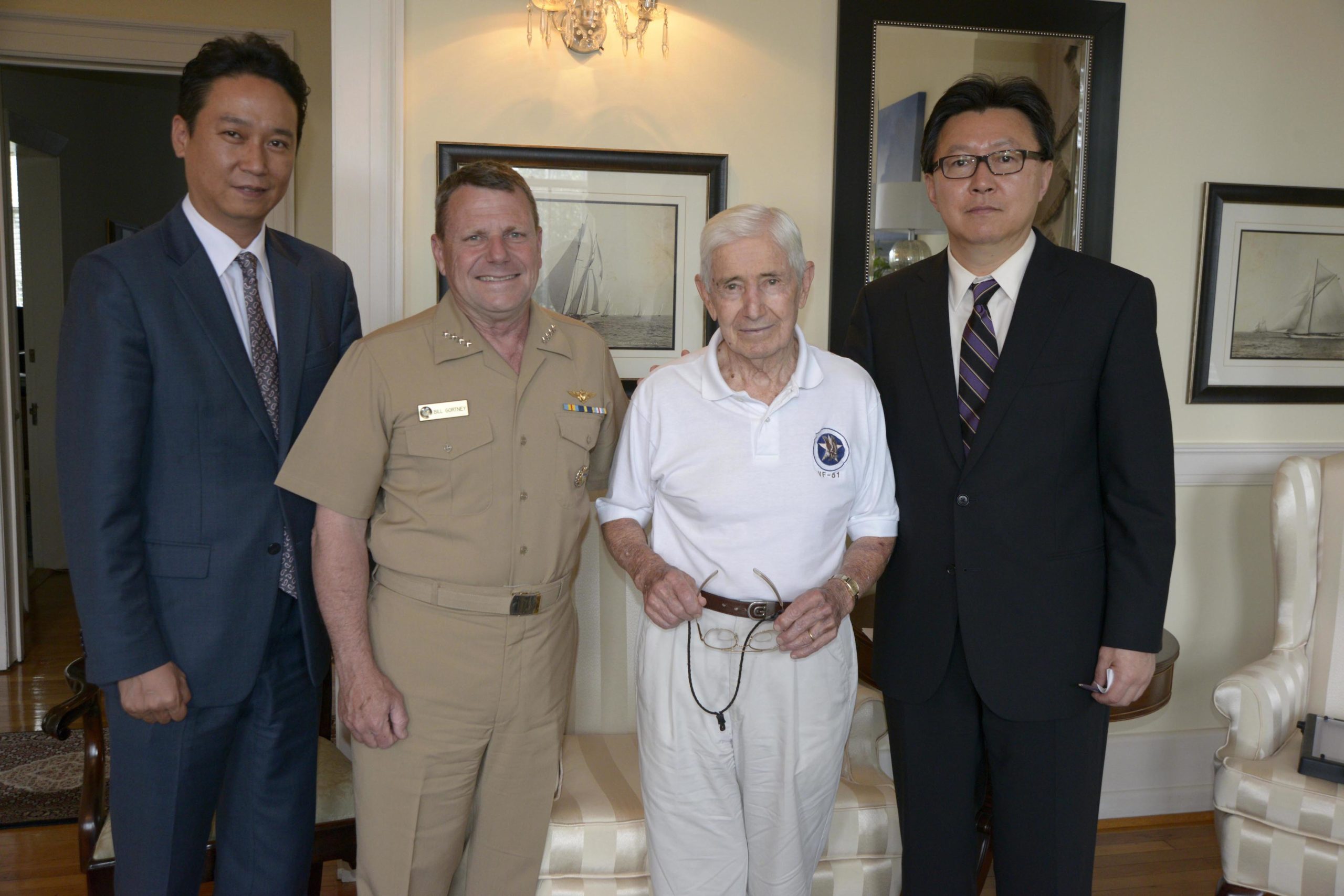 MPVA Officer Kim Ju Yong, Admiral William Gortney, Captain William Gortney, and President Han, Provided by Captain Jane Campbell, US Navy Fleet Forces, Norfolk VA on June 23, 2014