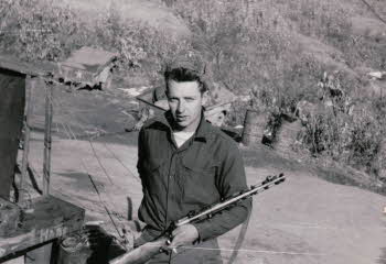 Bill O'KANE holding his gun
